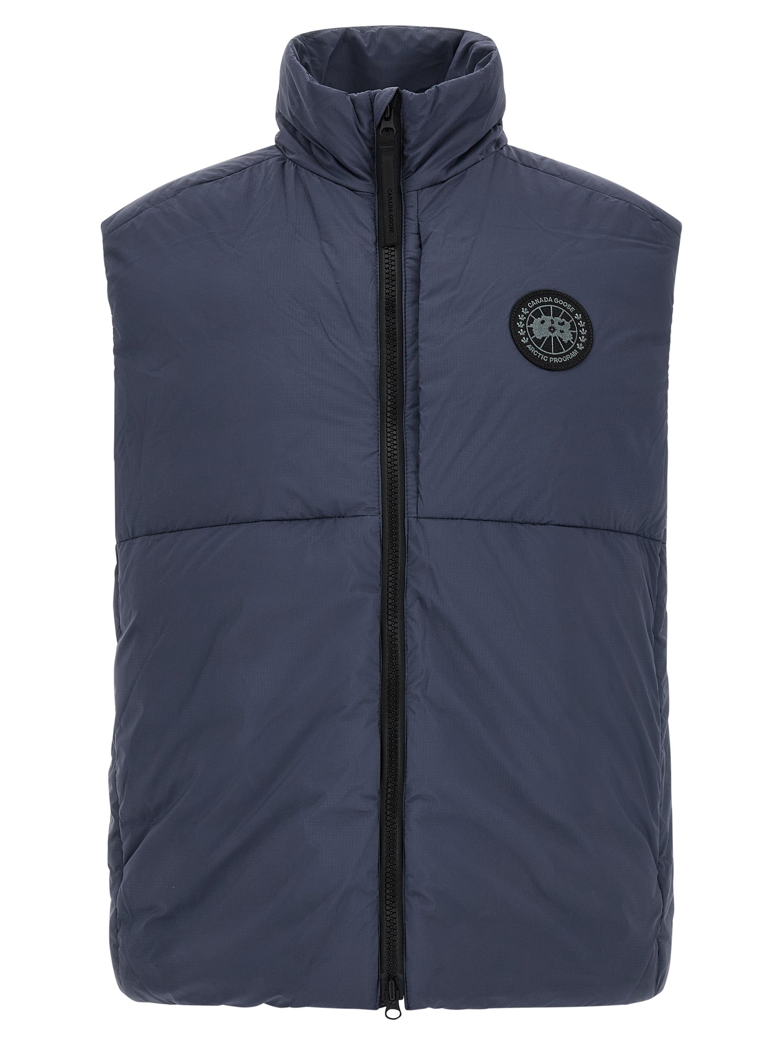 Vest by Canada Goose for men in polyamide black & dark-blue showcases a dynamic silhouette, perfectly balancing with a dynamic high-neck neckline for a sophisticated, high-fashion look.