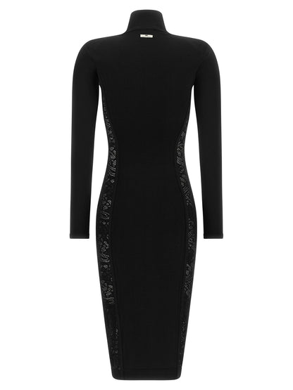 Dress by Elisabetta Franchi for women in poly cotton viscose mesh black & floral features an sultry silhouette defined by a mock neckline and , falling to an sultry midi for a sultry look.