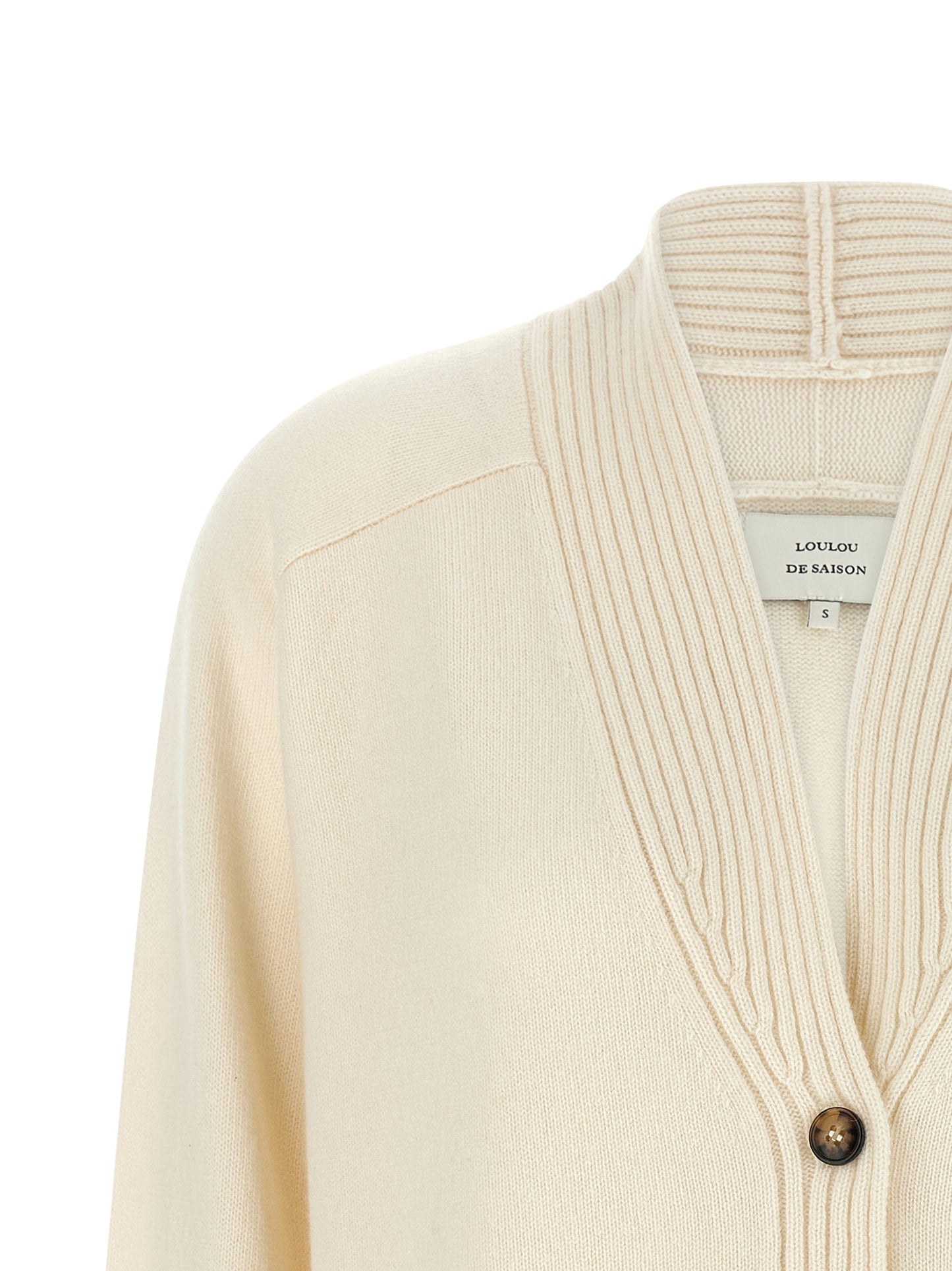 Cardigan by Loulou De Saison for women in cashmere ivory & white showcases a captivating silhouette, artfully detailed with a captivating and v-neck neckline for a truly sophisticated captivating look.