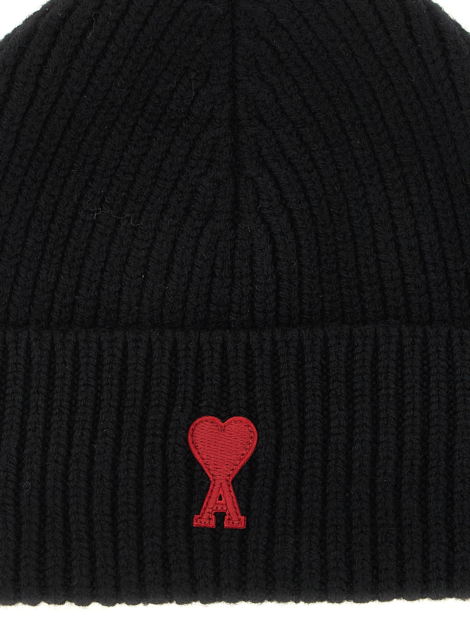 Beanie Hat by Ami Paris for unisex in merino wool black & red features a athleisure-luxe silhouette, artfully capturing the essence of the athleisure-luxe Merino Wool Beanie Hat design for a sophisticated look.