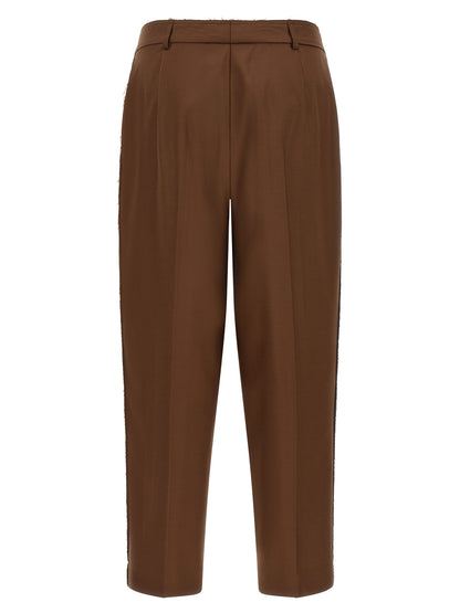 Casual Pants by Gianluca Capannolo for women in wool beige features an sophisticated high rise and tapered-leg with a precise long, creating a sophisticated and sophisticated silhouette.