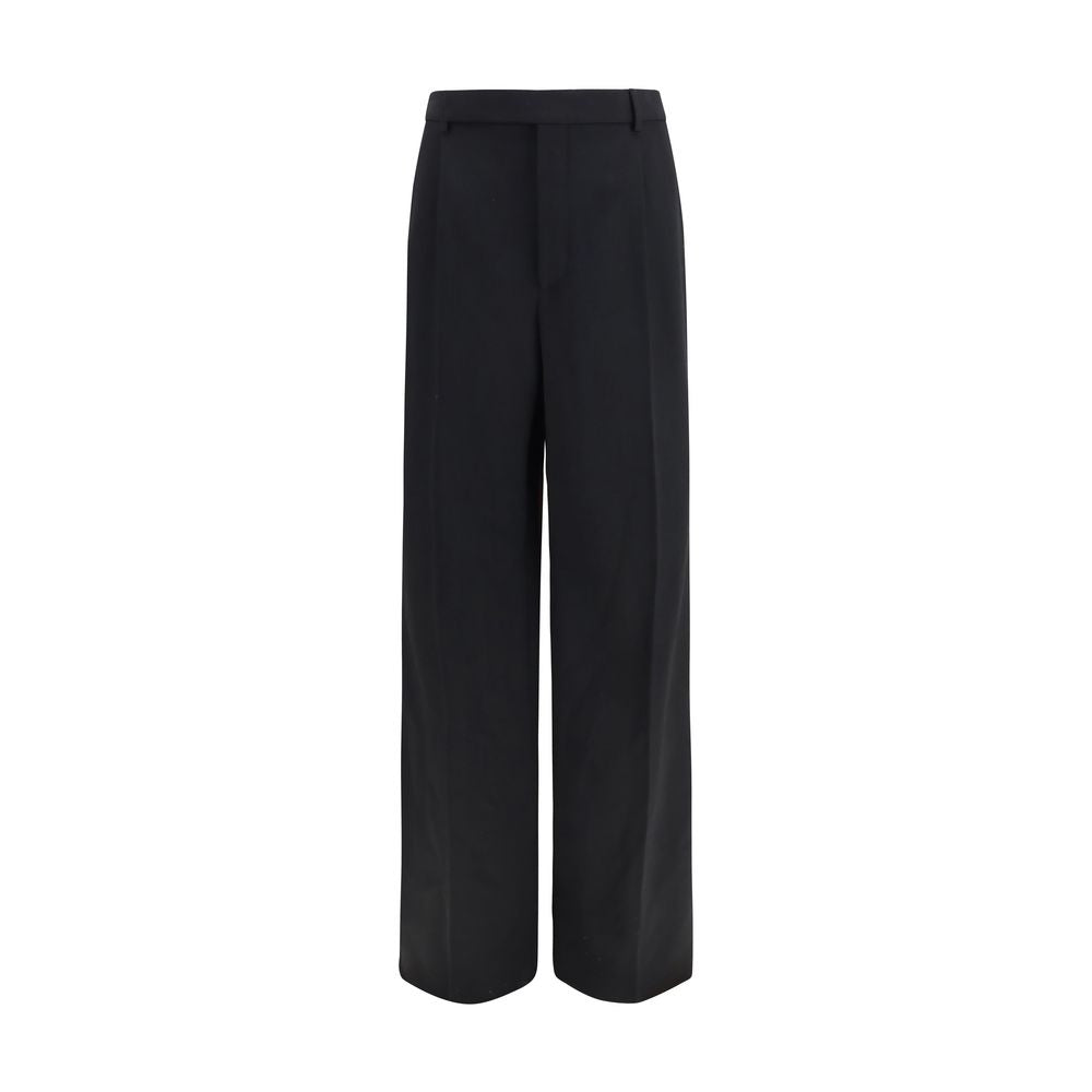 Trousers by Saint Laurent for men in wool black features a sculptural silhouette, showcasing a sculptural straight-leg & regular-fit and long with a sophisticated mid rise for a sculptural finish.
