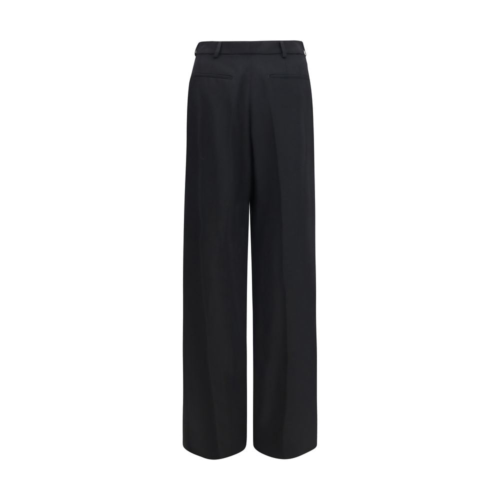 Trousers by Saint Laurent for men in wool black features an sartorial silhouette, showcasing a precise straight-leg & regular-fit and long with a sartorial mid rise for a refined look.