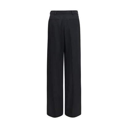 Trousers by Saint Laurent for men in wool black features an sartorial silhouette, showcasing a precise straight-leg & regular-fit and long with a sartorial mid rise for a refined look.