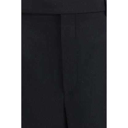 Trousers by Saint Laurent for men in wool black features a artisanal silhouette, showcasing a sophisticated straight-leg & regular-fit with a long and mid rise for a artisanal finish.