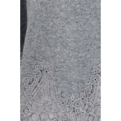 This Sweater by Ermanno Scervino for women in cashmere & capra leather gray presents a understated silhouette, featuring a sophisticated and for a understated finish.