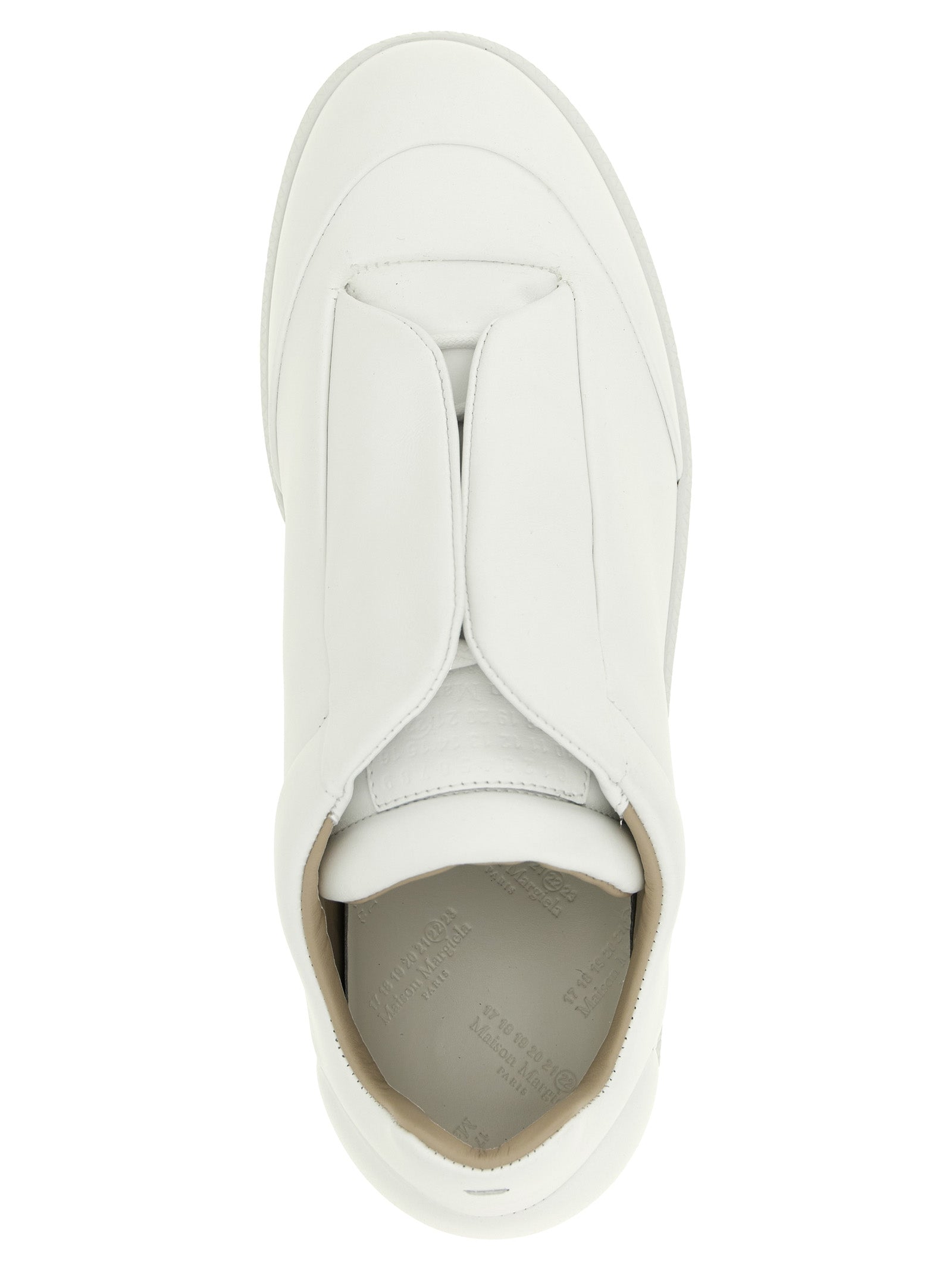 Sneakers by Maison Margiela for men in calfskin leather white & signature presents a sumptuous silhouette, artfully capturing the essence of the Men's Low Top Calfskin Leather Sneakers with its sumptuous low-top style design.