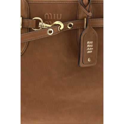 Shoulder Shopper Bag by Miu Miu for women in bos taurus calf leather brown showcases a enviable silhouette, artfully detailed with a secure , organized , and versatile shoulder-strap for a enviable look.