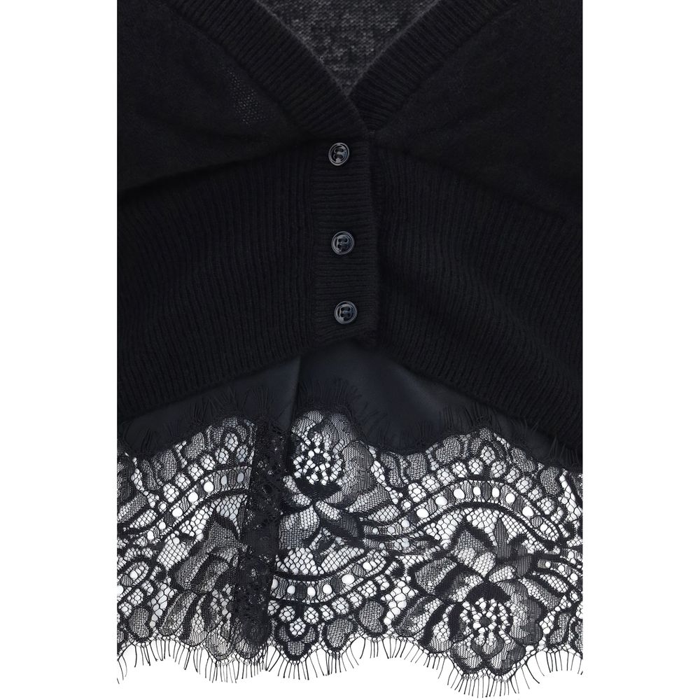 Cardigan by Ermanno Scervino for women in cashmere & capra leather black showcases a captivating silhouette, artfully detailed with a captivating and for a truly sophisticated captivating look.
