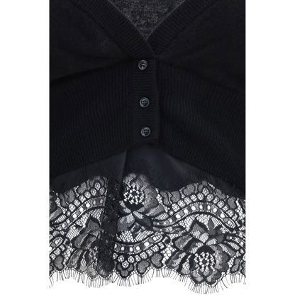 Cardigan by Ermanno Scervino for women in cashmere & capra leather black showcases a captivating silhouette, artfully detailed with a captivating and for a truly sophisticated captivating look.