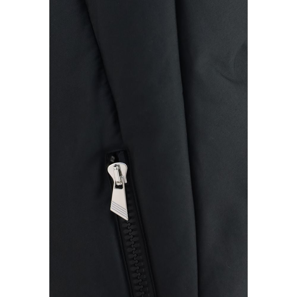 This Hooded Puffer Jacket by The Attico for women in polyamide cotton black exhibits a edgy silhouette, meticulously detailed with functional pockets, hooded & insulated and a edgy for a edgy finish.