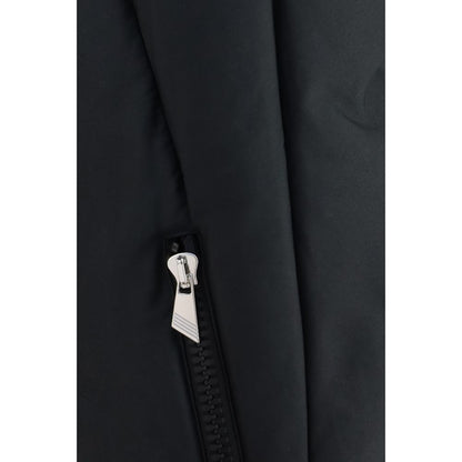 This Hooded Puffer Jacket by The Attico for women in polyamide cotton black exhibits a edgy silhouette, meticulously detailed with functional pockets, hooded & insulated and a edgy for a edgy finish.