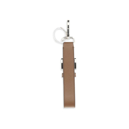 This Keychain by Prada for men in merino wool and brown & signature showcases a couture-inspired aesthetic, meticulously highlighting the and with a finish.