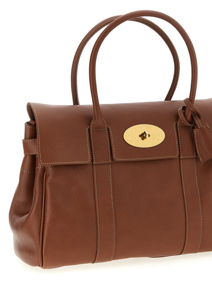 Shoulder Flap Bag by Mulberry for women in calfskin leather brown features a enviable silhouette, showcasing a secure flap, ample , and enviable shoulder-strap, adjustable-strap & handle for a enviable finish.