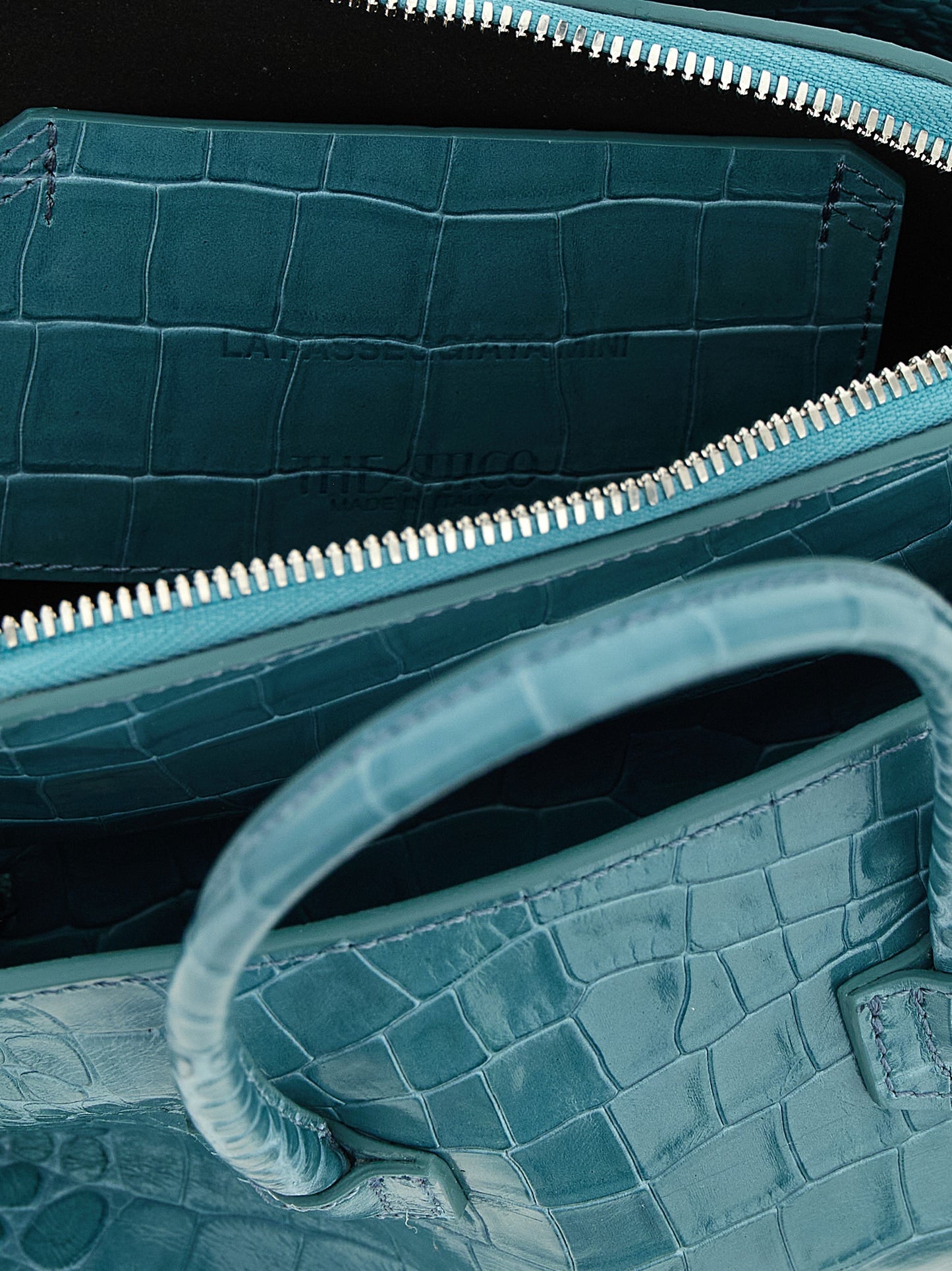 Mini Handbag by The Attico for women in bos taurus calf leather light-blue, silver & print features a contemporary silhouette, showcasing a secure zipper, ample , and contemporary shoulder-strap, detachable-strap & handle for a sophisticated look.