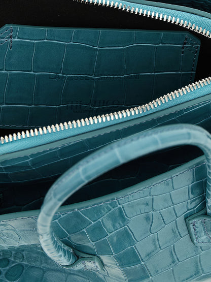 Mini Handbag by The Attico for women in bos taurus calf leather light-blue, silver & print features a contemporary silhouette, showcasing a secure zipper, ample , and contemporary shoulder-strap, detachable-strap & handle for a sophisticated look.
