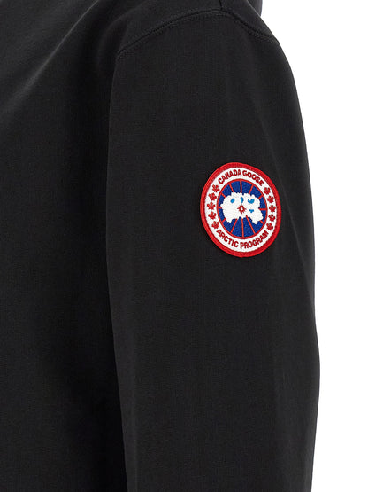Sweatshirt Hoodie by Canada Goose for men in cotton terrycloth black & silver features an dramatic silhouette, showcasing a sophisticated and dramatic for a refined, modern aesthetic.