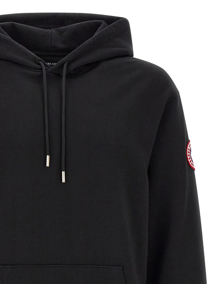 Sweatshirt Hoodie by Canada Goose for men in cotton terrycloth black features a authentic silhouette, showcasing a sophisticated hooded neckline and authentic detail for a refined finish.