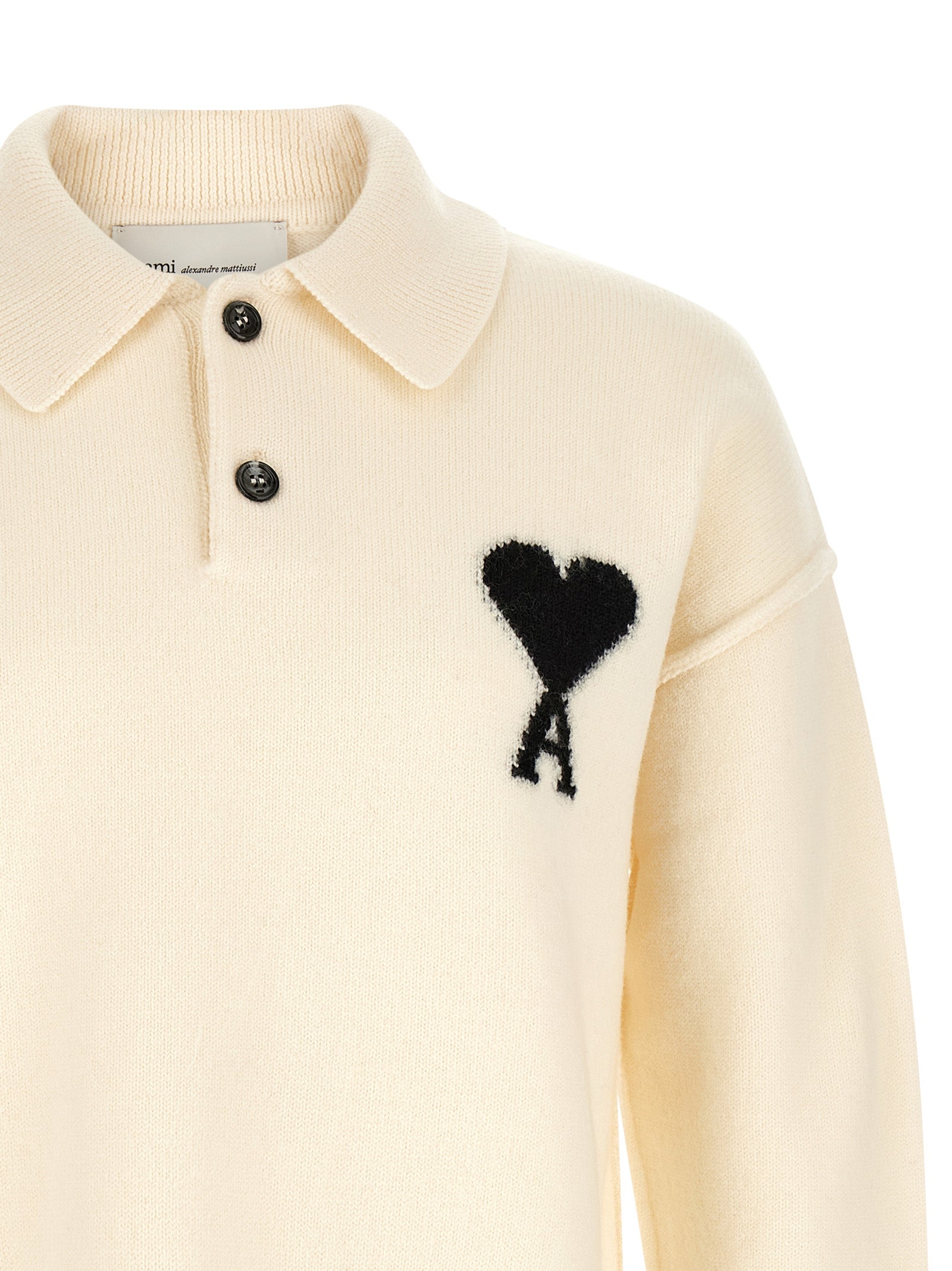 Polo Shirt by Ami Paris for men in wool bicolour, black, white & signature showcases a sharp silhouette, detailed with a refined and sharp for a sophisticated finish.