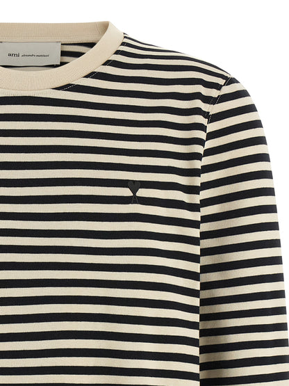 Activewear T-Shirt by Ami Paris for women in organic cotton bicolour, black, white & striped presents a kinetic silhouette, showcasing the kinetic and alongside functional for a premium, athletic look.
