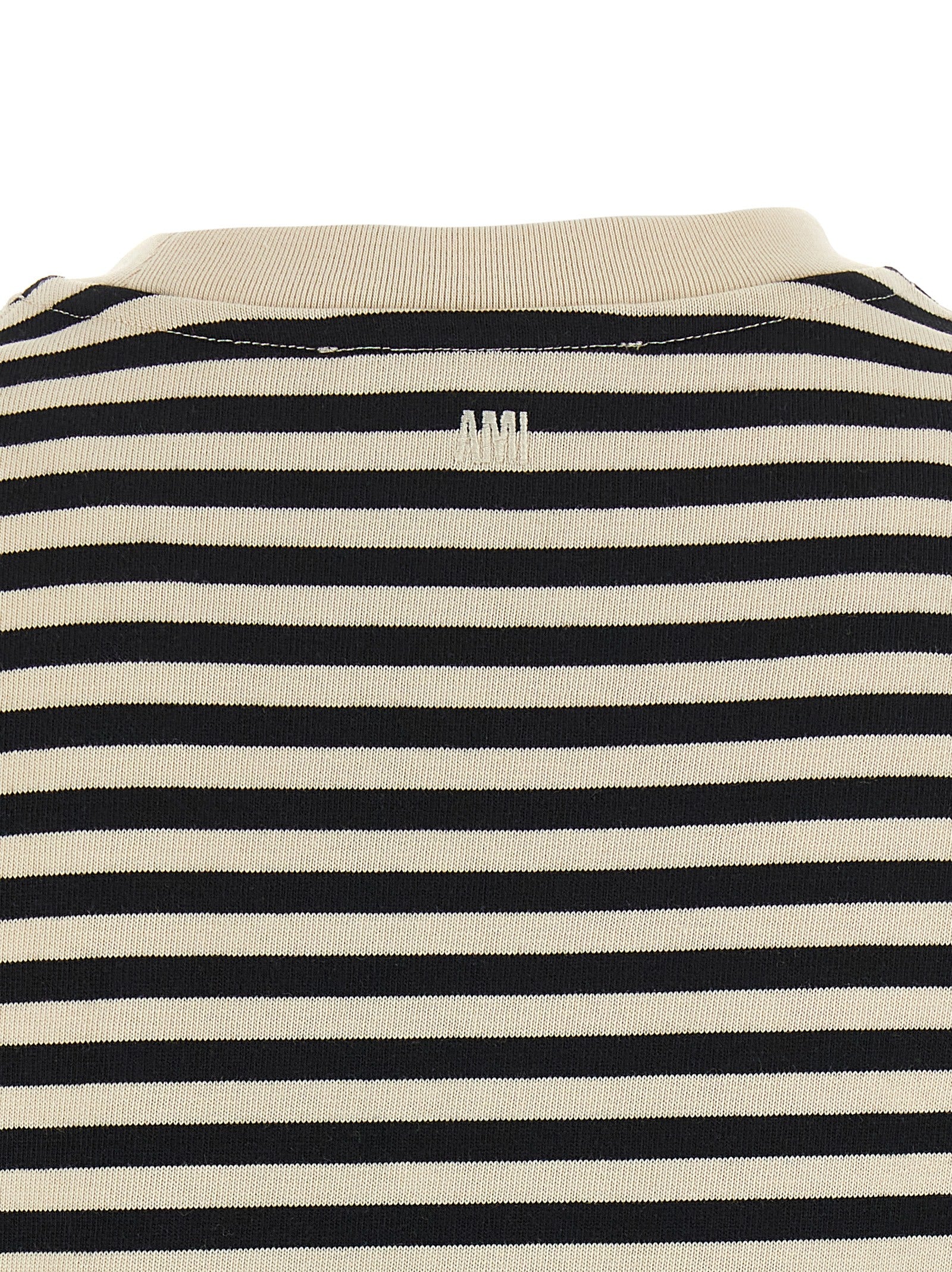 Activewear T-Shirt by Ami Paris for women in organic cotton bicolour, black, white & striped features a dynamic silhouette with and enhanced by functional .