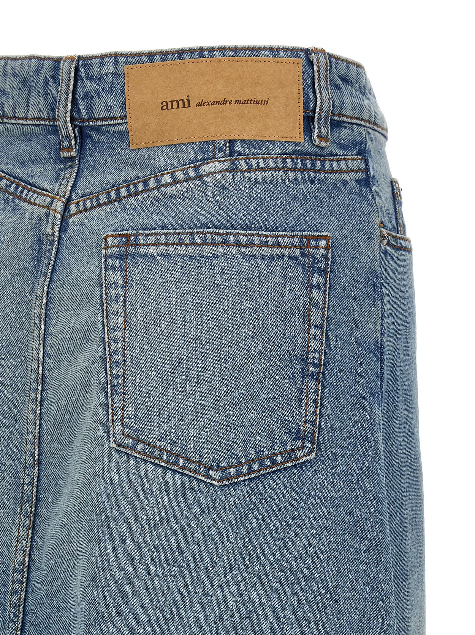 Skirt by Ami Paris for women in denim cotton & nickel blue features an relaxed-yet-refined silhouette that elegantly showcases the Women's Denim Cotton & Nickel Skirt design and sophisticated midi.