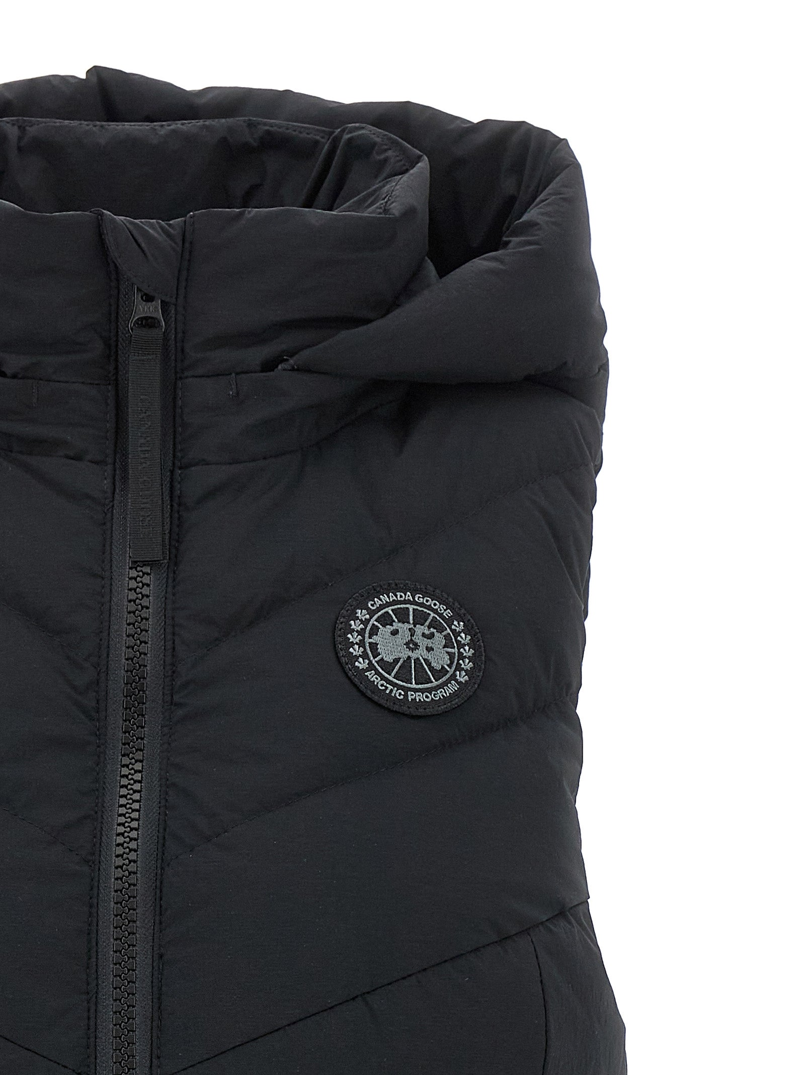 Hooded Vest by Canada Goose for women in polyamide & goose-down black showcases a dynamic silhouette, perfectly balancing pockets, hooded & insulated with a dynamic hooded neckline for a sophisticated, high-fashion look.