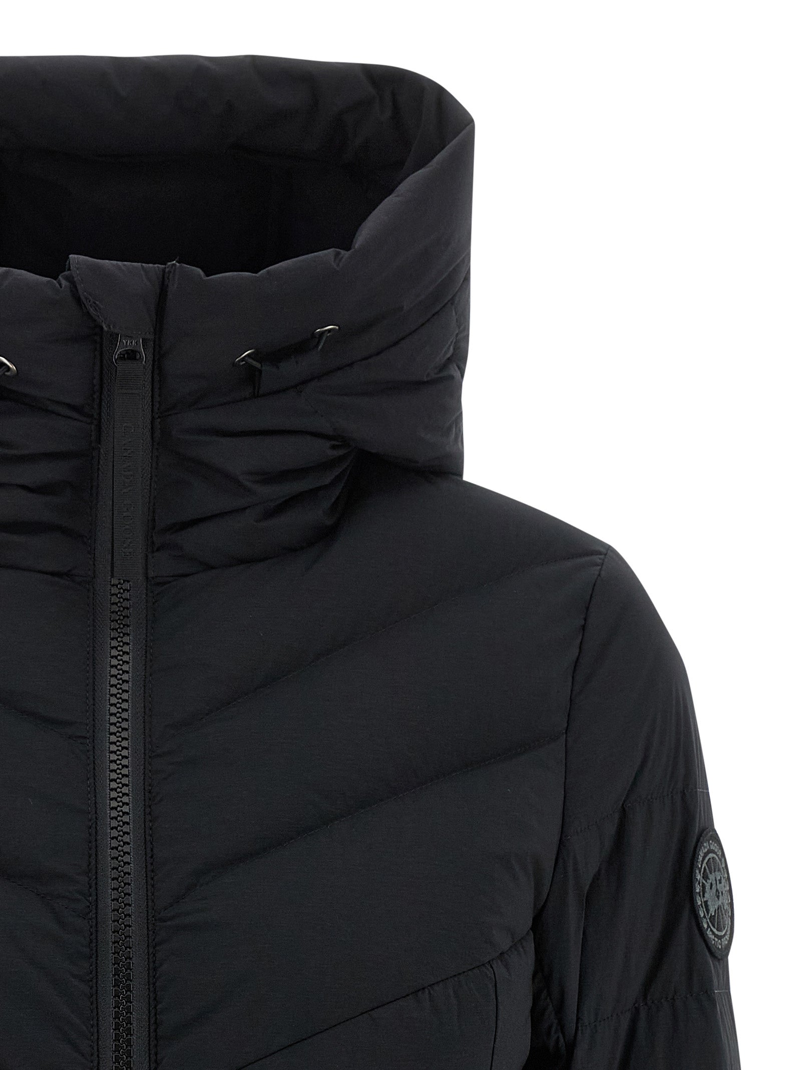Hooded Puffer Jacket by Canada Goose for women in polyamide & feathers black features a dramatic silhouette, showcasing a sophisticated hooded high-neck neckline and distinctive pockets, hooded & insulated for a dramatic aesthetic.