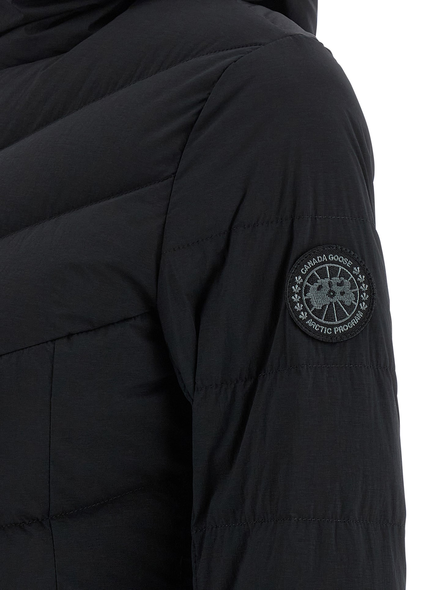 Hooded Puffer Jacket by Canada Goose for women in polyamide & feathers black presents a effortlessly chic silhouette, showcasing a sophisticated and premium pockets, hooded & insulated for a truly effortlessly chic finish.