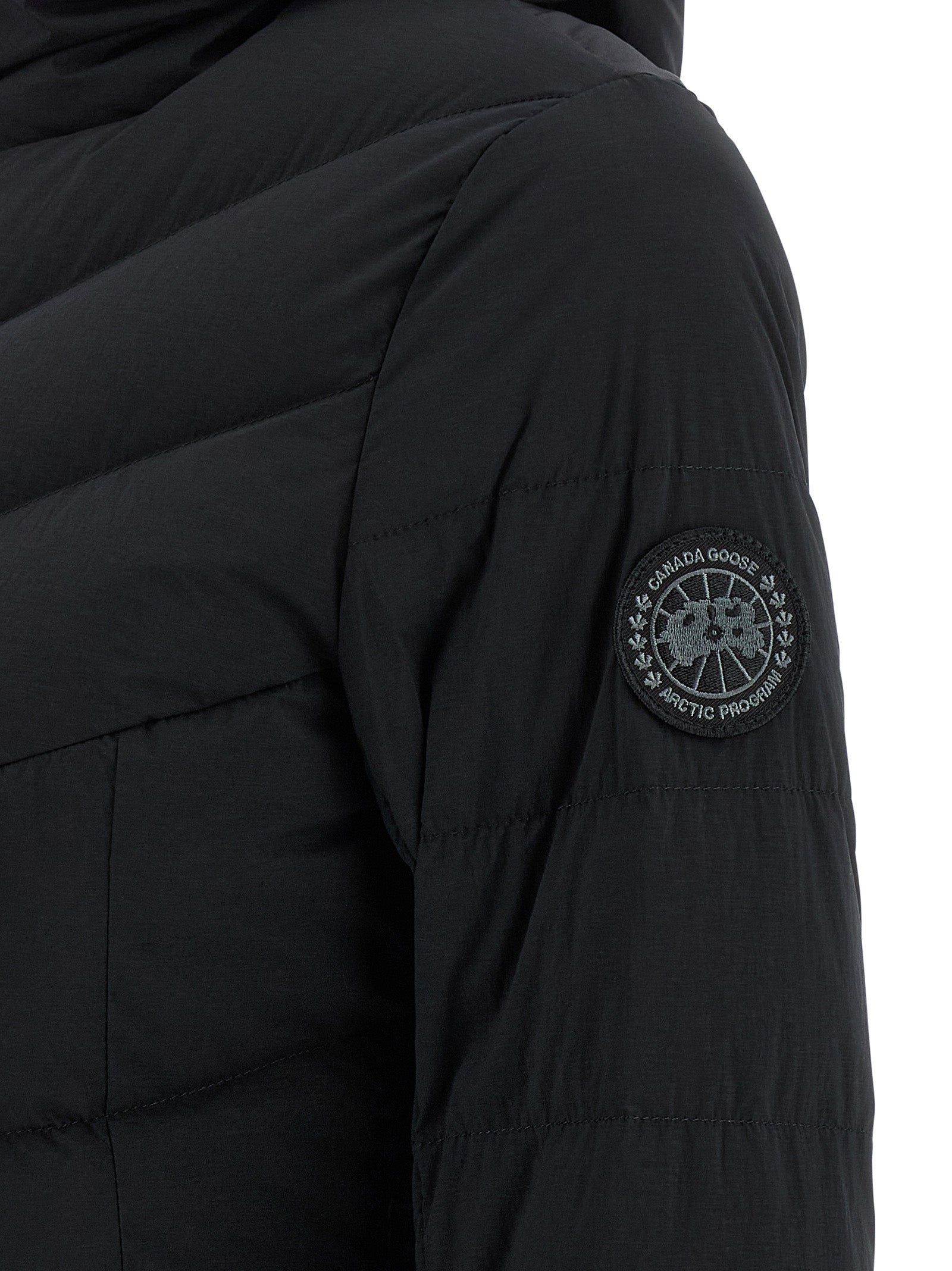 Hooded Puffer Jacket by Canada Goose for women in polyamide & feathers black presents a effortlessly chic silhouette, showcasing a sophisticated and premium pockets, hooded & insulated for a truly effortlessly chic finish.