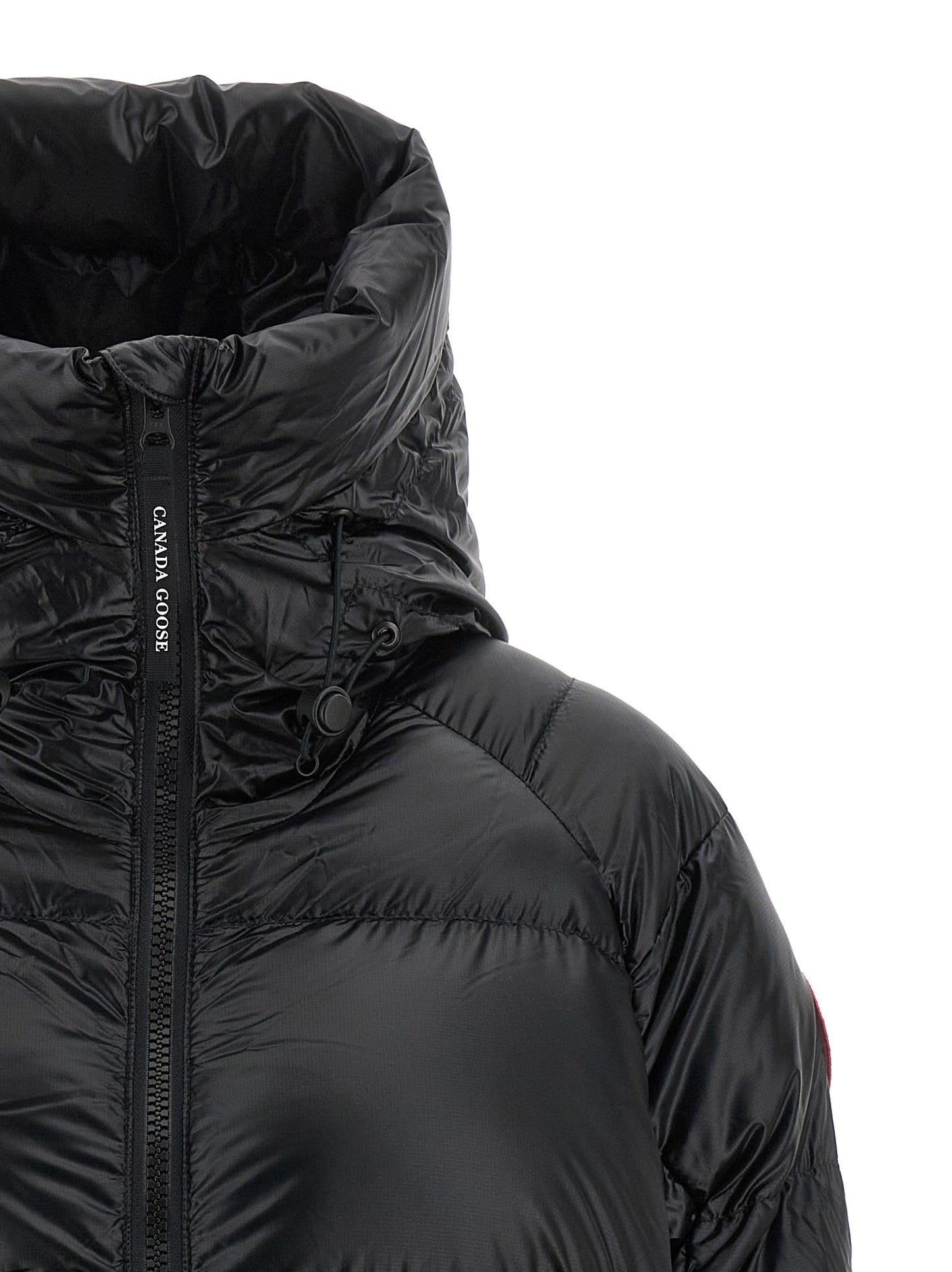 Hooded Overcoat by Canada Goose for women in polyamide black features an voluminous silhouette, showcasing distinct windproof & hooded and a voluminous hooded high-neck neckline for a truly voluminous aesthetic.