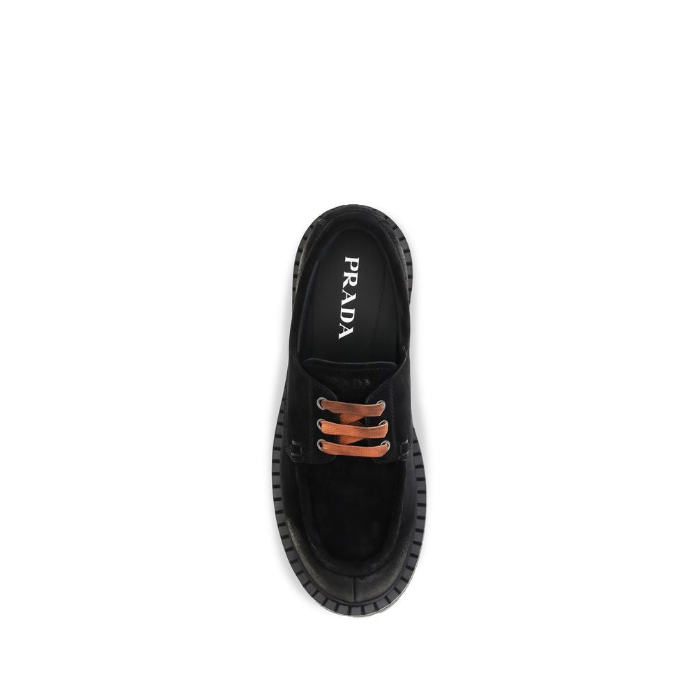 Loafer Slip-On Lace-Up Shoes by Prada for men in suede leather & rubber black features an effortless chic silhouette, showcasing the Men's Suede Leather & Rubber Loafer Slip-On Lace-Up Shoes design with an effortless chic and a for a effortless chic look.