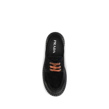Loafer Slip-On Lace-Up Shoes by Prada for men in suede leather & rubber black features an effortless chic silhouette, showcasing the Men's Suede Leather & Rubber Loafer Slip-On Lace-Up Shoes design with an effortless chic and a for a effortless chic look.