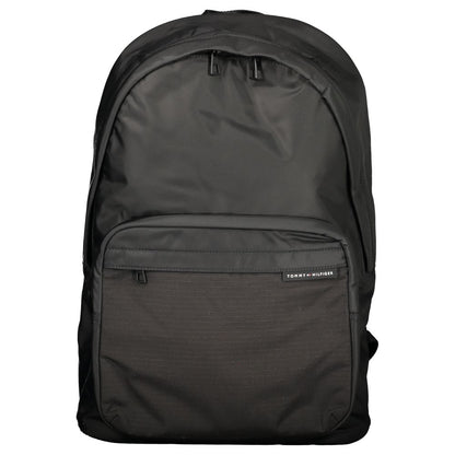 Backpack by Tommy Hilfiger for men in polyester black presents a stately Polyester Backpack design, showcasing a secure zipper with ample external-pockets, internal-pockets & laptop-compartment and versatile backpack-strap, adjustable-strap & handle for a stately finish.