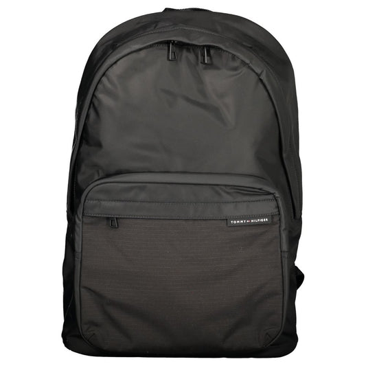 Backpack by Tommy Hilfiger for men in polyester black presents a stately Polyester Backpack design, showcasing a secure zipper with ample external-pockets, internal-pockets & laptop-compartment and versatile backpack-strap, adjustable-strap & handle for a stately finish.
