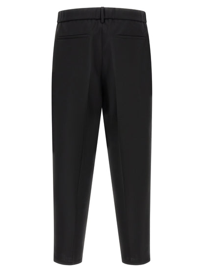 Trousers by Jil Sander for men in mohair & virgin wool black presents a smart silhouette, meticulously detailed with a smart cropped, a smart cropped, and a smart .