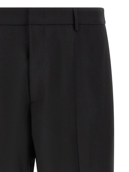 Trousers by Jil Sander for men in mohair & virgin wool black presents a perennial silhouette, meticulously tailored with a cropped cut, cropped finish, and an elegant .