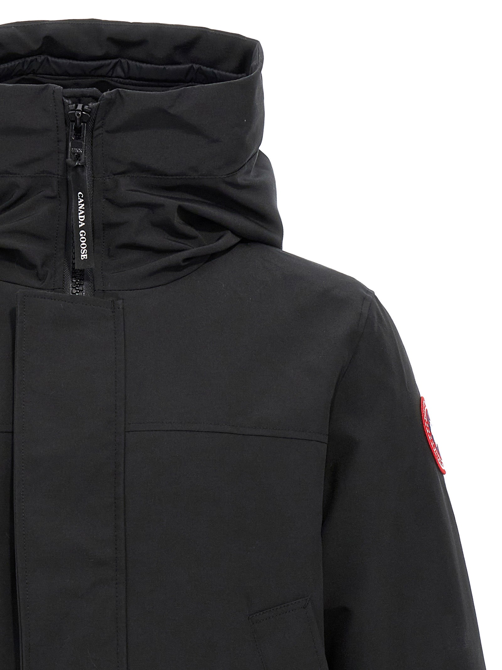 This Parka by Canada Goose for men in polyester goose-down & cotton black presents a utilitarian silhouette, meticulously detailed with windproof, hooded & insulated and a utilitarian hooded high-collar neckline for a sophisticated, weather-ready look.