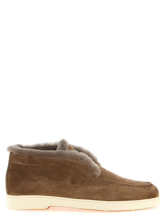 Flat Ankle Winter Boots by Santoni for women in suede calfskin leather & lamb shearling brown features an enchanting design from the Women's Suede Calfskin Leather & Lamb Shearling Flat Ankle Winter Boots collection, highlighting a enchanting flat and for a refined look.