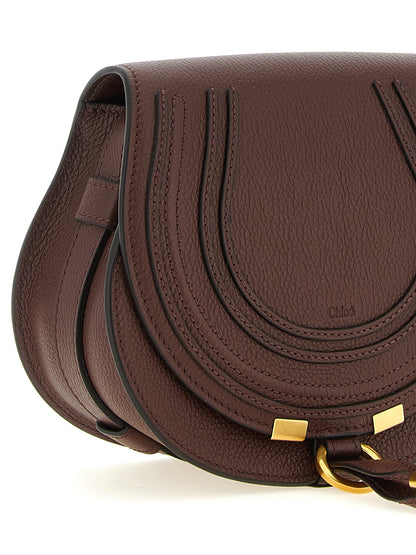 Crossbody Saddle Handbag by Chloé for women in linen & bos taurus calfskin leather brown & gold features an multi-faceted design with a secure , ample , and versatile crossbody-strap, shoulder-strap & adjustable-strap for a multi-faceted finish.