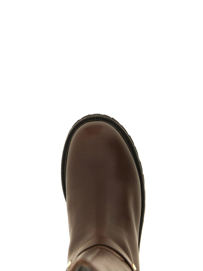 Ankle Over-The-Knee Strap Boots by Twinset for women in leather & metal brown showcases a ergonomic silhouette from the Women's Leather & Metal Ankle Over-The-Knee Strap Boots collection, featuring a ergonomic and a ergonomic .