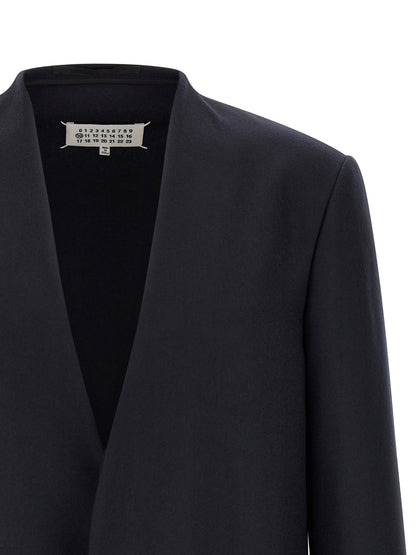 Blazer by Maison Margiela for men in flannel & virgin wool navy & signature presents a distinguished silhouette, detailed with a distinguished v-neck lapel neckline and distinctive for a truly sophisticated finish.