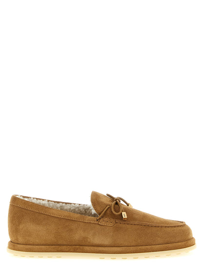 Flat Moccasin Moccasins Loafer Slip-On Shoes by Tod's for women in suede calfskin leather beige & signature features an effortless chic silhouette, showcasing the Women's Suede Calfskin Leather Flat Moccasin Moccasins Loafer Slip-On Shoes design with an effortless chic flat and a for a effortless chic look.