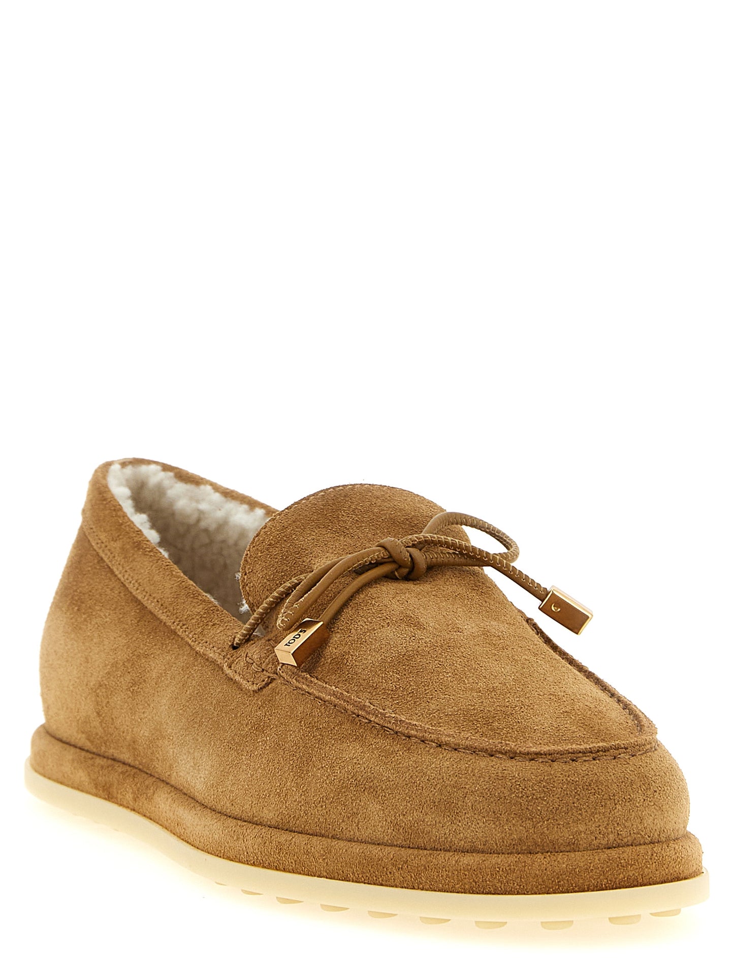 Flat Moccasin Moccasins Loafer Slip-On Shoes by Tod's for women in suede calfskin leather beige & signature features an ergonomic silhouette, perfectly showcasing Women's Suede Calfskin Leather Flat Moccasin Moccasins Loafer Slip-On Shoes with its distinct flat and elegant .