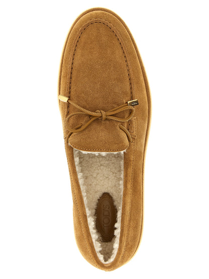 Flat Moccasin Moccasins Loafer Slip-On Shoes by Tod's for women in suede calfskin leather beige & signature features an dynamic silhouette from the Women's Suede Calfskin Leather Flat Moccasin Moccasins Loafer Slip-On Shoes collection, defined by a dynamic and flat for a dynamic look.