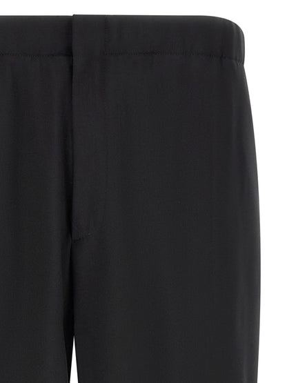 Trousers by Lardini for men in virgin wool black features a tailored silhouette with a tailored straight-leg, defined by its long and a sophisticated .