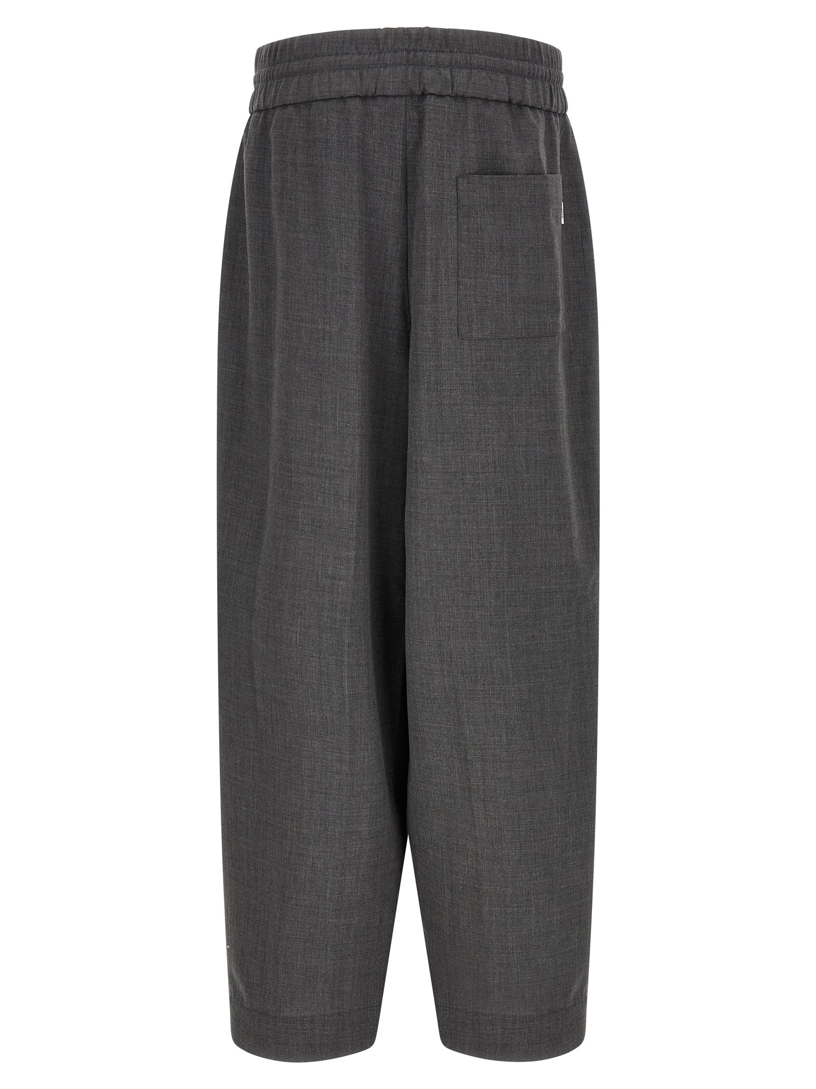 Trousers by Ami Paris for men in virgin wool gray & signature features a sculptural silhouette, showcasing a sculptural relaxed-fit and long with a sophisticated high rise for a sculptural finish.