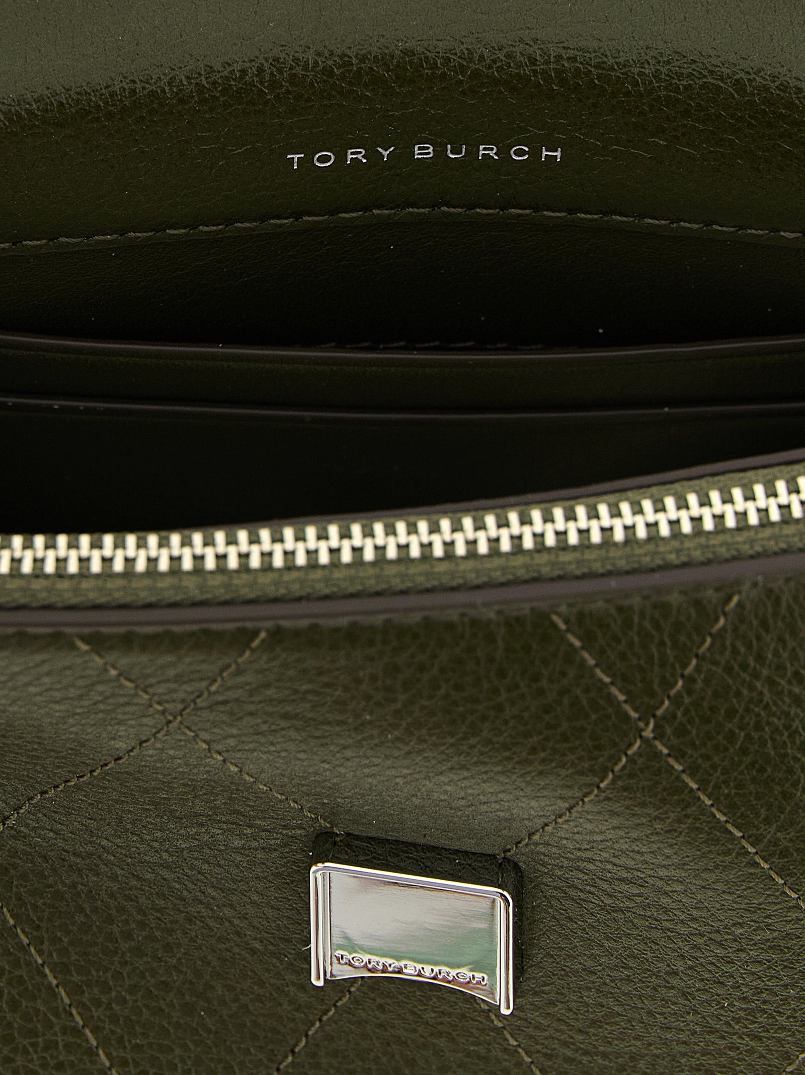 Mini Flap Handbag by Tory Burch for women in cowhide leather bicolour, green & signature features a contemporary silhouette, showcasing a secure flap, zipper & magnetic, ample , and contemporary shoulder-strap & handle for a sophisticated look.