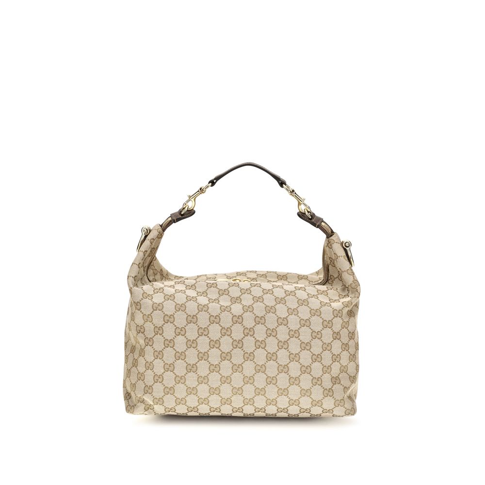 Medium Shoulder Bag by Gucci for men in nylon leather & canvas beige & gold features an effortlessly chic silhouette with a secure zipper, ample , and versatile shoulder-strap, adjustable-strap, detachable-strap & handle for effortlessly chic everyday luxury.