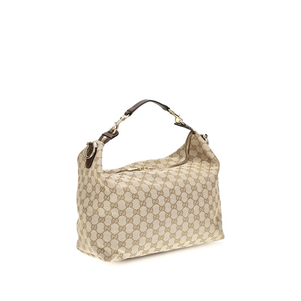 Medium Shoulder Bag by Gucci for men in nylon leather & canvas beige & gold features a enviable silhouette, showcasing a secure zipper, ample , and enviable shoulder-strap, adjustable-strap, detachable-strap & handle for a enviable finish.